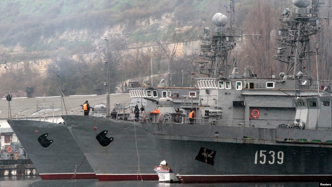Russian military vessels are anchored at a navy base in the Ukrainian Black Sea port of Sevastopol in Crimea, Feb. 27, 2014.