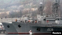Russian military vessels are anchored at a navy base in the Ukrainian Black Sea port of Sevastopol in Crimea, Feb. 27, 2014.