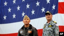 U.S. Navy Adm. Harry Harris, left, commander of the U.S. Pacific Command and Australian Navy Vice Adm. David Johnston take part in a ceremony marking the start of Talisman Saber 2017, a biennial joint military exercise.