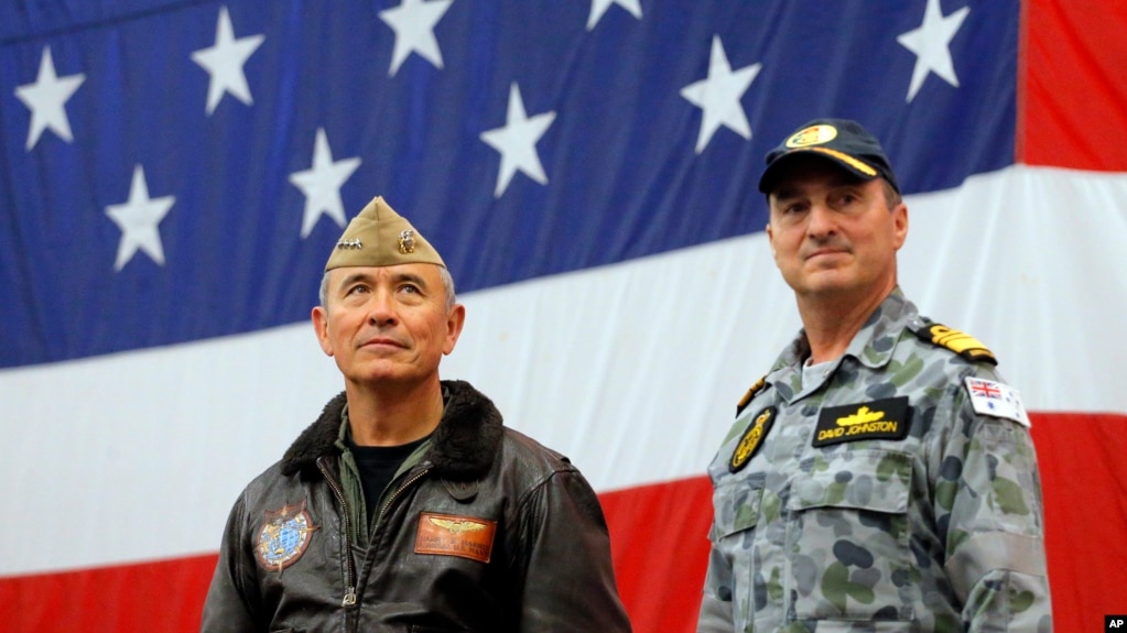 FILE - U.S. Navy Adm. Harry Harris, left, commander of the U.S. Pacific Command and Australian Navy Vice Adm. David Johnston take part in a ceremony marking the start of Talisman Saber 2017, a biennial joint military exercise between the United States and Austra