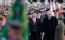 FILE - Czech Republic's President Milos Zeman, right, welcomes his Chinese counterpart Xi Jinping at the Prague Castle in Prague, Czech Republic, March 29, 2016.