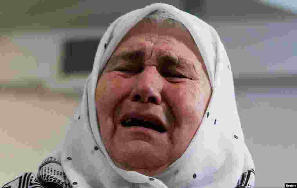 A woman reacts after the verdict on former Bosnian Serb political leader Radovan Karadzic&#39;s appeal of his 40-year sentence for war crimes, in the Memorial center Potocari, near Srebrenica, Bosnia and Herzegovina, March 20, 2019.