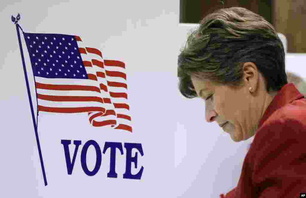 Republican Senate candidate State Sen. Joni Ernst casts her ballot in the general election, Nov. 4, 2014, in Red Oak, Iowa. 