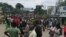 Protesters march toward the Malawi Electoral Commission office in Blantyre, Malawi, Feb. 13, 2020, intending to shutter the entrance gate. (Lameck Masina/VOA)