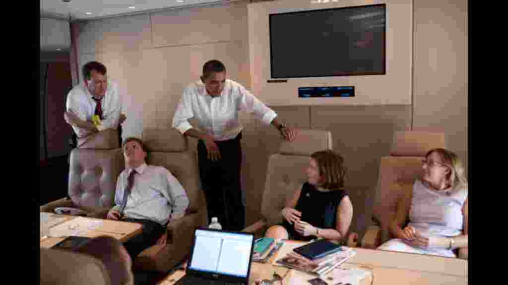 President Barack Obama talks with staff about the erupting volcano at Mt. Merapi in Indonesia, while flying on Air Force One from Mumbai to New Delhi, Nov. 7, 2010. (Official White House Photo by Pete Souza)