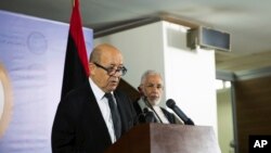French Minister of Foreign Affairs Jean-Yves Le Drian, left, with the Libyan Minister of Foreign Affairs Mohammed Siala during a press conference after meeting with the President of the Council Faiz Al-Sarraj in, Tripoli, Sept. 4, 2017.