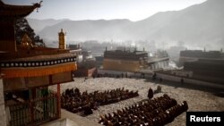 Monks gather to pray at the Labrang monastery prior Tibetan New Year in Xiahe county, Gansu Province February 21, 2012.