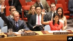 U.S. Ambassador to the United Nations Nikki Haley, right, votes during a Security Council meeting on a new sanctions resolution that would increase economic pressure on North Korea.