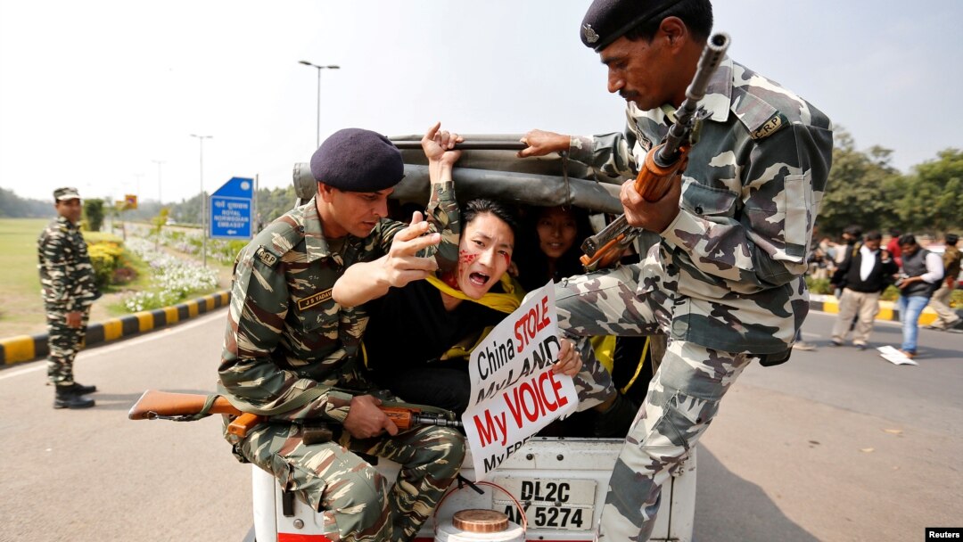 FILE - Tibetan activists are detained by police during a protest held to mark the 58th anniversary of the Tibetan uprising against Chinese rule, outside the Chinese embassy in New Delhi, India, March 10, 2017. 