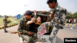 FILE - Tibetan activists are detained by police during a protest held to mark the 58th anniversary of the Tibetan uprising against Chinese rule, outside the Chinese embassy in New Delhi, India, March 10, 2017. 