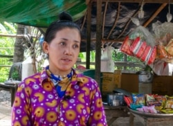 Thaong Bopha, 30, has switched from rice harvesting to fish farming in Peamror district, Prey Veng province, Cambodia, July 23, 2020. (Aun Chhengpor/VOA Khmer)