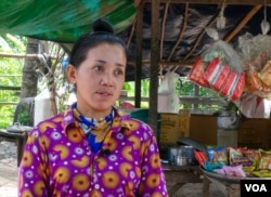 Thaong Bopha, 30, has switched from rice harvesting to fish farming in Peamror district, Prey Veng province, Cambodia, July 23, 2020. (Aun Chhengpor/VOA Khmer)