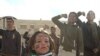 Kurd li bajarê Kobanî'yê derdikevin kolanan û Serhildana 12'ê Adarê bibîr tînin. Adar, 12, 2012