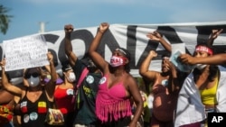 Demonstrators shouts slogans during a protest against the government's response in combating COVID-19, demanding the impeachment of President Jair Bolsonaro, in Rio de Janeiro, Brazil, May 29, 2021.