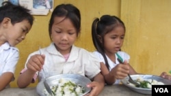 Students at En Komar Primary School in Kampong Thom province have receive breakfast on Tuesday, June 10, 2014. The breakfasts are part of a World Food Program initiative that aims to feed 3.5 million students by 2016.