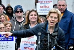 FILE - Sen. Elizabeth Warren, D-Mass., speaks after she joined striking Stop & Shop supermarket employees on the picket line in Somerville, Mass., April 12, 2019.