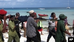 A man rescued from a ferry accident is taken to a hospital in Nungwi, Zanzibar, September 10, 2011.