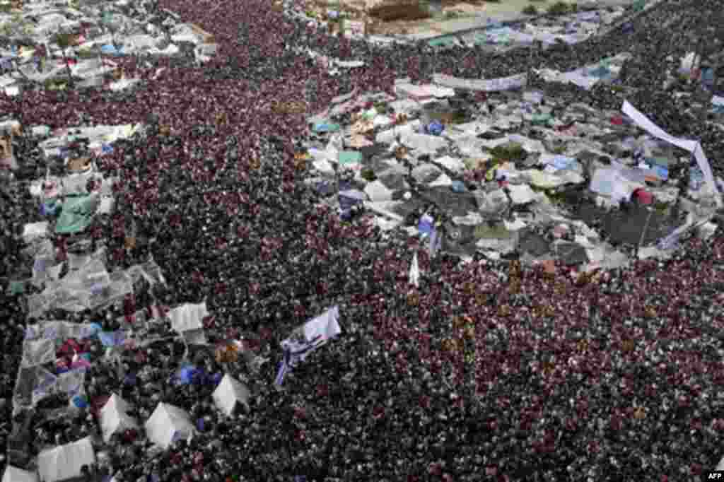 Tens of thousands of anti-government protesters gather in Tahrir Square in Cairo, Egypt, Friday, Feb. 11, 2011. Egypt's military threw its weight Friday behind President Hosni Mubarak's plan to stay in office through September elections while protesters f