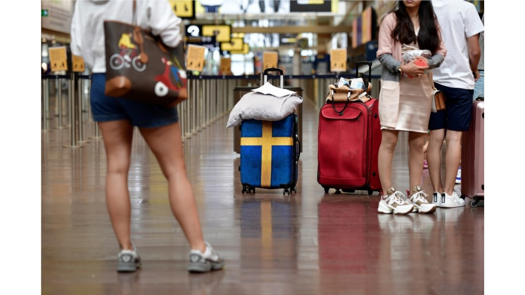 Passengers prepare to check in at Arlanda airport for the first chartered TUI flight to Rhodes in Greece since the outbreak of the coronavirus disease (COVID-19), in Stockholm.