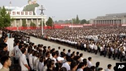 Tens of thousands of North Koreans celebrate construction of the massive Masik ski resort at a rally at Kim Il Sung Square on Pyongyang, June 14, 2013.