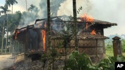 Flames engulf a house in Gawdu Zara village, northern Rakhine state, Myanmar, Sept. 7, 2017. Security forces and allied mobs have burned down thousands of homes in Northern Rakhine state, where the vast majority of the country's 1.1 million Rohingya lived, in recent weeks. 