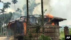 Flames engulf a house in Gawdu Zara village, northern Rakhine state, Myanmar, Sept. 7, 2017. Security forces and allied mobs have burned down thousands of homes in Northern Rakhine state, where the vast majority of the country's 1.1 million Muslim Rohingyas lived.