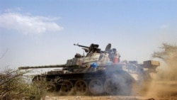 A Yemeni army tank moves to take a position in Saada, north of Sanaa, during clashes with Houthi rebels, 11 Feb 2010