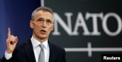 FILE - NATO Secretary-General Jens Stoltenberg addresses a news conference during a NATO defence ministers meeting at the Alliance headquarters in Brussels, Belgium, Feb. 15, 2018.