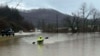 In this photo provided by Donnie Smith, a kayaker navigates floodwaters, Feb. 15, 2025, in rural Knox County, Kentucky. 