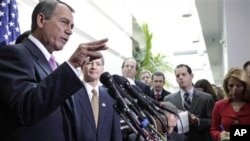 House Speaker John Boehner of Ohio, and Rep. Jeb Hensarling, R-Texas, meet with reporters on Capitol Hill in Washington after their closed GOP caucus meeting ahead of President Barack Obama's State of the Union speech, 25 Jan 2011