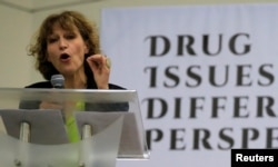 FILE - Agnes Callamard, a United Nations Special Rapporteur on extrajudicial, summary or arbitrary executions, gestures while delivering a statement during a "Drug issues, Different Perspectives" forum at a compound of University of the Philippines in Quezon city, metro Manila, Philippines, May 5, 2017.