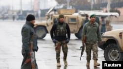 Afghan security forces keep watch near the site of an attack at the Marshal Fahim military academy in Kabul, Afghanistan January 29, 2018.REUTERS/Mohammad Ismail - RC1D16822F60