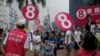 FILE - Supporters from different political groups urge people to vote for their candidates in the Legislative Council elections in Hong Kong, Sept. 3, 2016. 