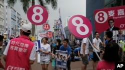 Supporters from different political groups urge people to vote for their candidates in the Legislative Council election in Hong Kong, Sept. 3, 2016. Hong Kongers headed to the polls Sunday in the first major election since 2014 pro-democracy street protests.