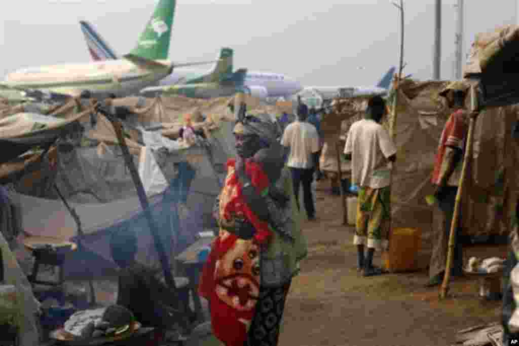 Christian refugees living in makeshift shelters near the airport in Bangui, Central African Republic, Tuesday Jan. 28, 2014, as they try to escape from the deepening divisions between the country's Muslim minority and Christian majority. Christian refug