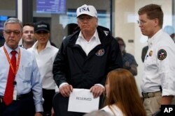 President Donald Trump and first lady Melania Trump participate in a tour of the Texas Department of Public Safety Emergency Operations Center, Aug. 29, 2017, in Austin, Texas.