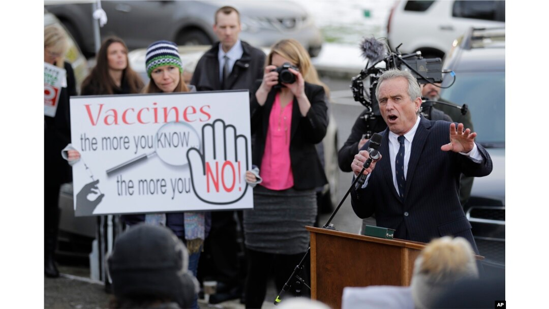 Robert Kennedy Jr., right, speaks at a rally held in opposition to a proposed bill that would remove parents' ability to claim a philosophical exemption to opt their school-age children out of the combined measles, mumps and rubella vaccine, Feb. 8, 2019, at the Capitol in Olympia, Wash.