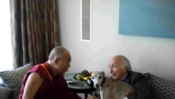 FILE - Jonathan Mirsky, seen with the Dalai Lama during the latter's visit to London on June 20, 2012, was deeply concerned about Tibet. Lily the Whippet was granted special permission to bear witness.