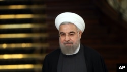 伊朗总统鲁哈尼在德黑兰会晤中国国家主席习近平后出席联合记者会。（2016年1月23日）