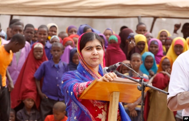 FILE - Malala Yousafza, speaks to refugees in the Dadaab refugee camp, Kenya, July 12, 2016.