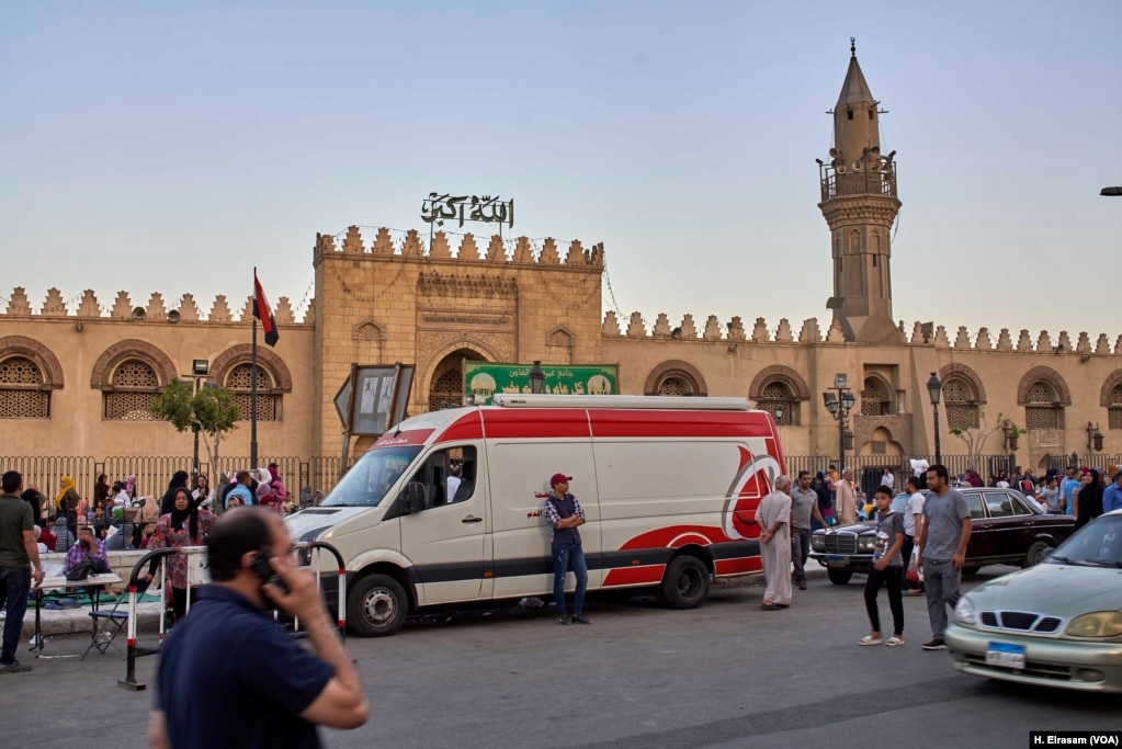 Ambulances wait to aid people who collapse from overcrowding and heat at Amr Ibn al-As mosque, in old Cairo, Egypt, May 31, 2019.