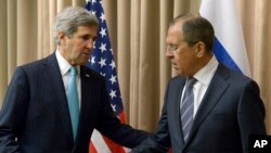 U.S. Secretary of State John Kerry, left, shakes hands with Russian Foreign Minister Sergey Lavrov before a bilateral meeting to discuss the ongoing situation in Ukraine as diplomats from the U.S., Ukraine, Russia and the European Union gather for discussions in Geneva Thursday, April 17, 2014. 