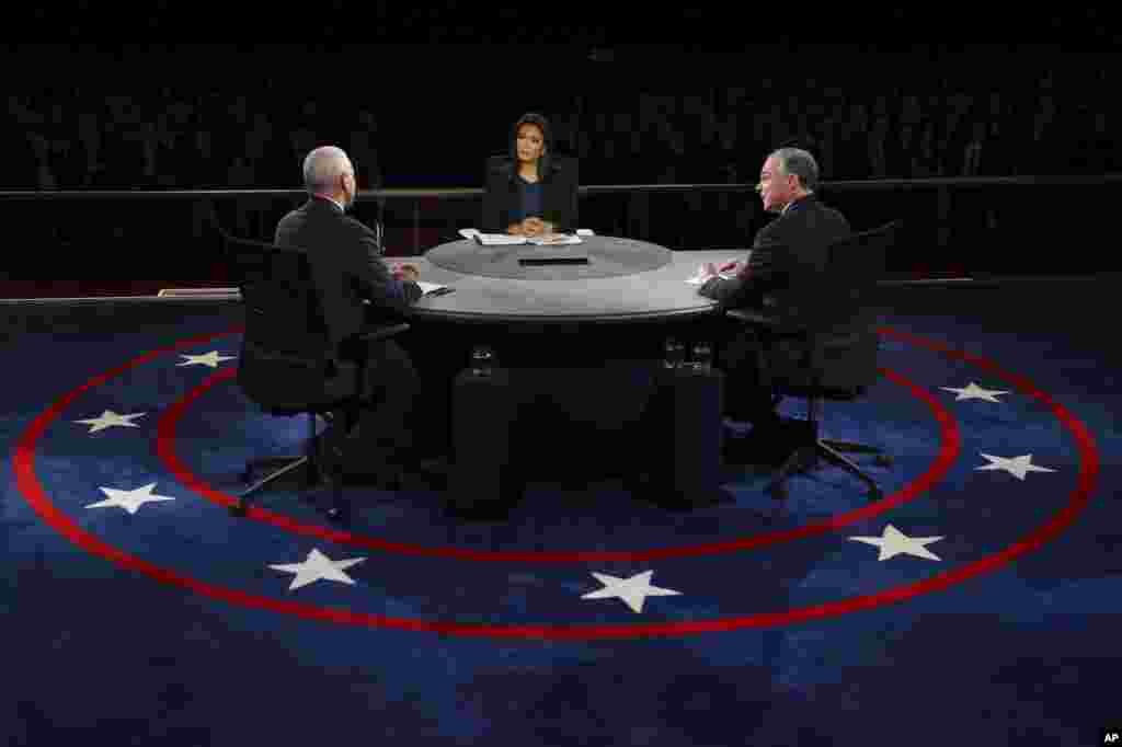 Republican vice-presidential nominee Gov. Mike Pence and Democratic vice-presidential nominee Sen. Tim Kaine discuss a question during the debate.