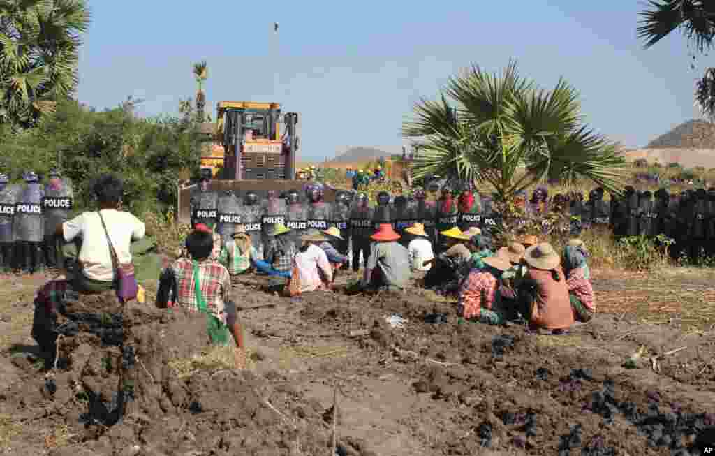 According to activists and opposition lawmakers, a woman was fatally shot Monday during a crackdown on protesters at the controversial Chinese-backed copper mine near Monywa in northwestern Myanmar, Dec. 22, 2014. 