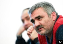 FILE - Independent Azerbaijani journalist Afgan Mukhtarli speaks in Baku, Azerbaijan, March 2, 2014.