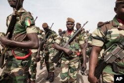 FILE - Senegal soldiers take part in the opening ceremony of Flintlock, anti-terrorism training in Thies, Senegal, Feb. 8, 2016.