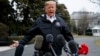 FILE - President Donald Trump talks with reporters outside the White House in Washington, March 8, 2019.