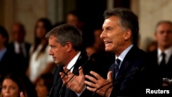 FILE - Argentina's President Mauricio Macri gestures as he speaks during the opening session of the 134th legislative term at the Congress in Buenos Aires, Argentina, March 1, 2016. 
