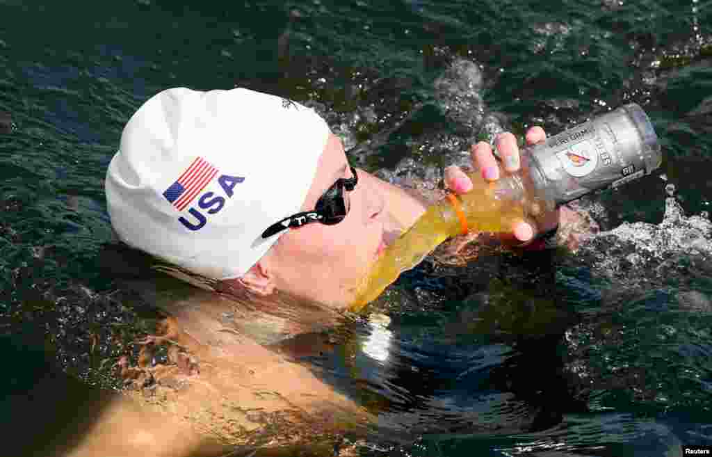 Haley Anderson of the U.S. tries to drink during the women's 10km marathon.