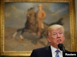 FILE - U.S. President Donald Trump announces a presidential proclamation placing tariffs on steel and aluminum imports at the White House in Washington, March 8, 2018.